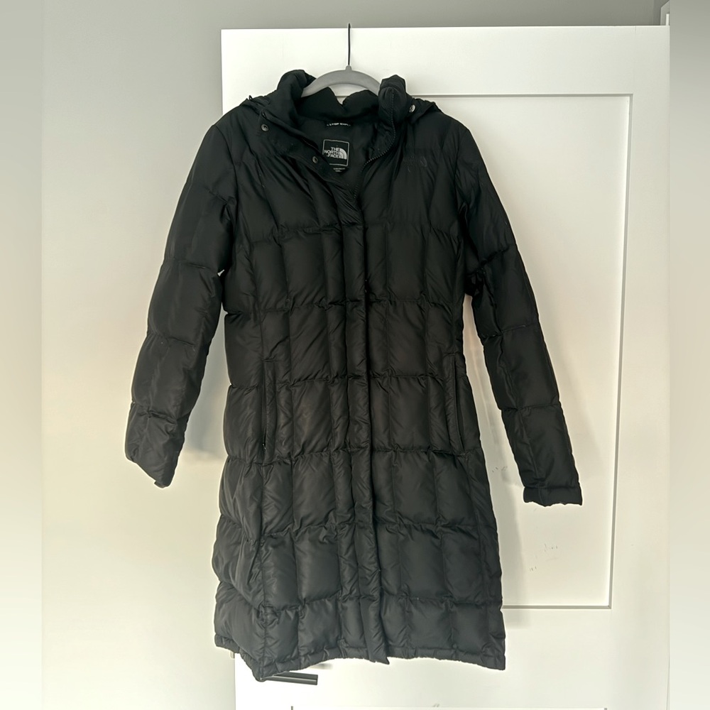 The North Face women’s black puffer knee length coat